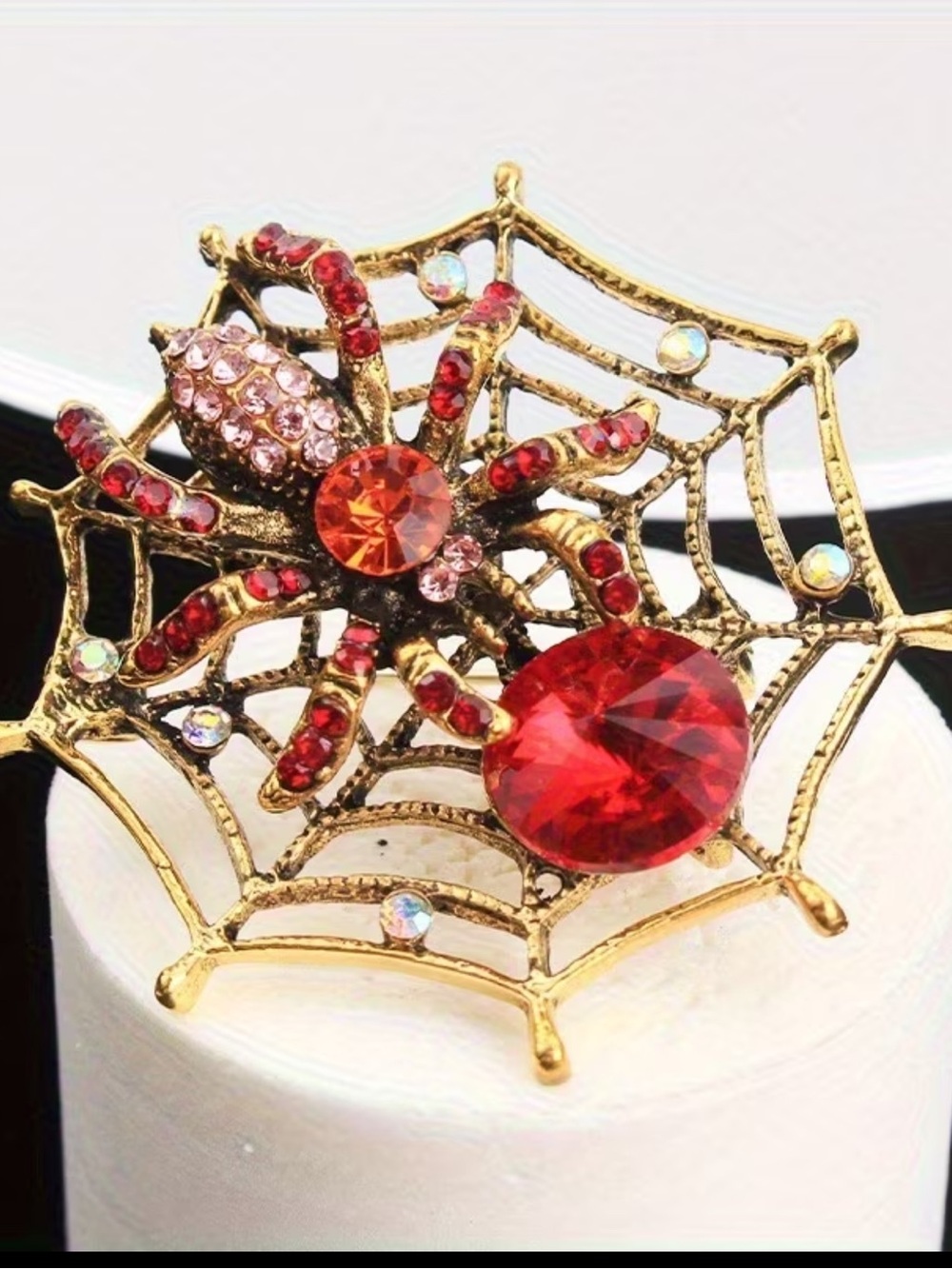 Gold-Tone Spider Web Brooch with Red & Pink Crystals